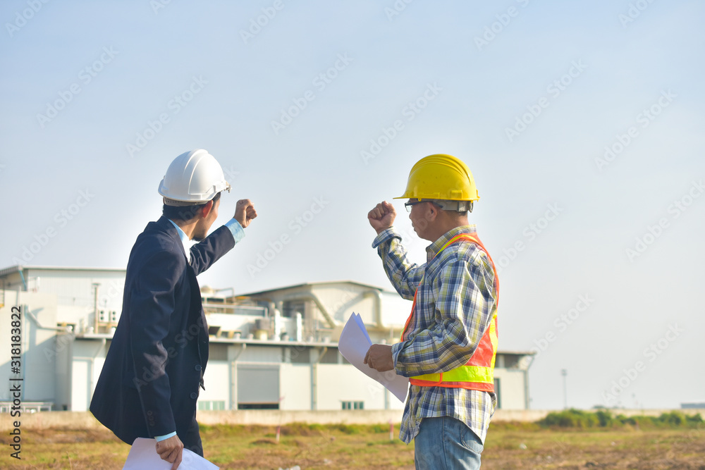 Project manager and Engineer construction holding hand success project,Production manager and Engineer holding hand success project factory background Project manager and Engineer construction holding hand success project,Production manager and Engineer holding hand success project factory background