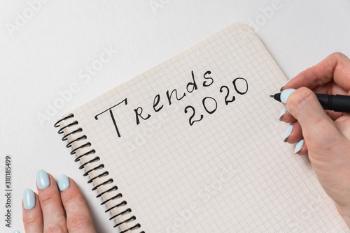 Trends 2020. New ideas and plans. Handwritten inscription in the notebook. White background