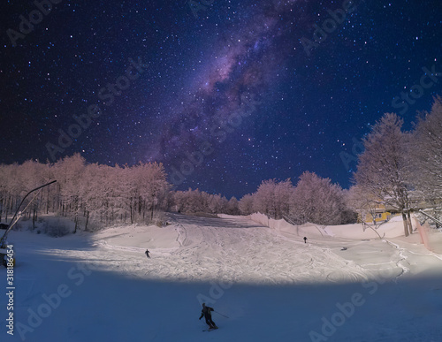 skiing in the night on a beautiful italian mountain