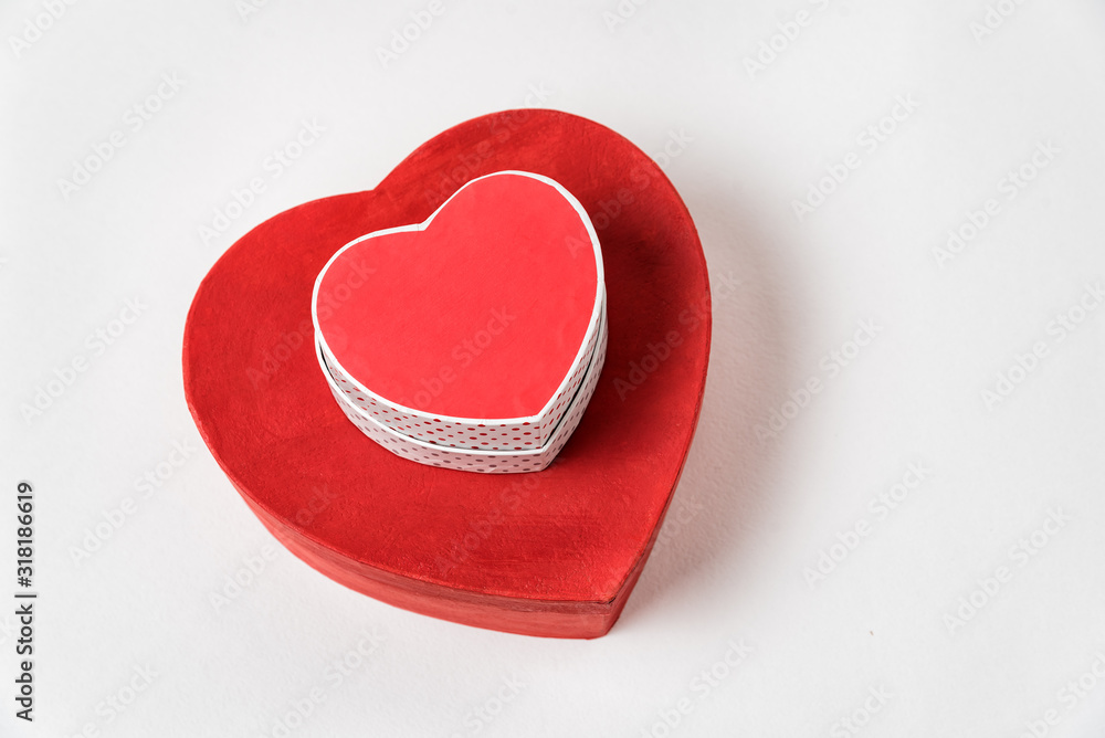 Big and small red heart shaped boxes on table. Top view. Gifts on Valentine's Day Big and small red heart shaped boxes on table. Top view. Gifts on Valentine's Day