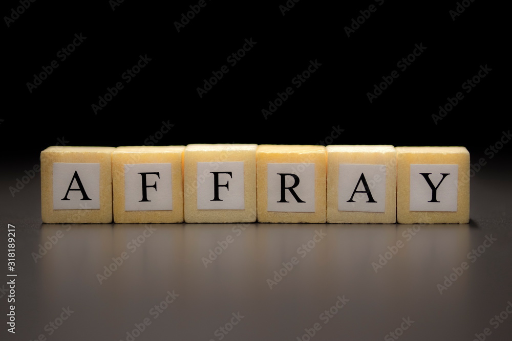 Φωτογραφία The word AFFRAY written on wooden cubes isolated on a black background