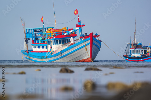 Asian bright fishing boat on the sunset