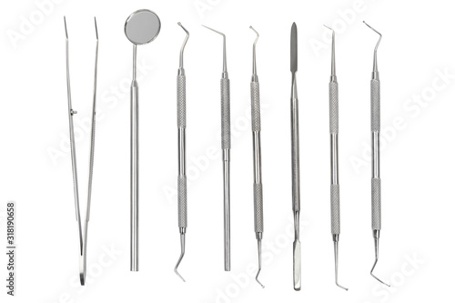 set of metal dental instruments photo