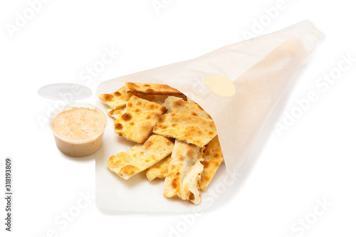 Salted crackers in a paper bag isolated on white background.