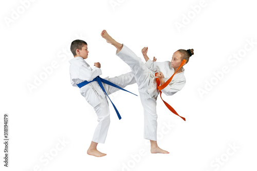 Girl and boy beats kicks legs