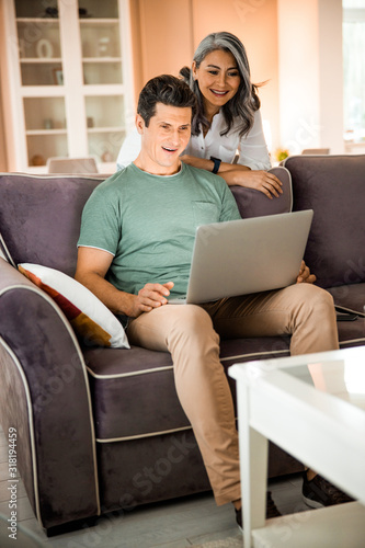 Smiling adult couple in love in the living room © Yakobchuk Olena