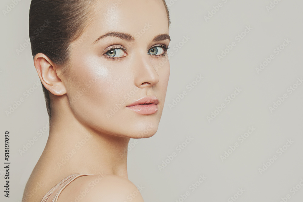 Young attractive woman closeup portrait. Beautiful face Young attractive woman closeup portrait. Beautiful face