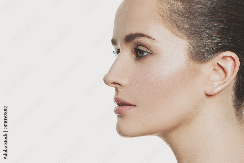Attractive profile of young pretty woman face close up Attractive profile of young pretty woman face close up