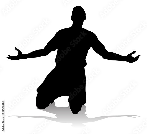 A soccer or football player in silhouette