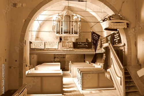 Inside the church of the fortified medieval saxon evangelic church in the village Alma Vii (Almen) Transylvania, Romania. Organ photo