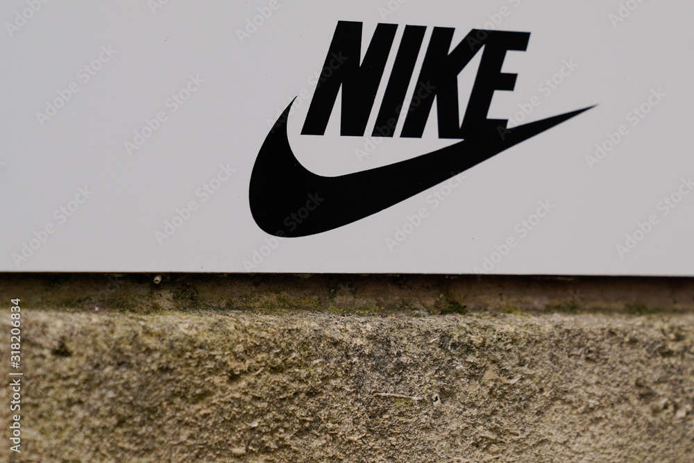 Nike sign sportswear store shop logo supplier of athletic manufacturer  sports equipment Stock Photo | Adobe Stock