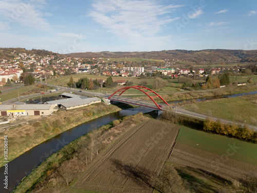 Strzyzow, Poland - 9 9 2018: View of the factory and residential area for workers with low multi-storey houses. Panorama from the drone or quadrocopter with a bird's-eye view. Architectural layout of  photo