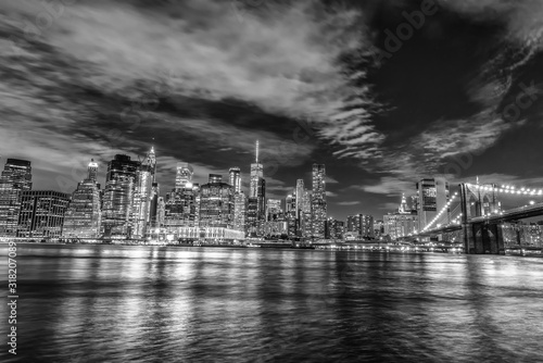 Skyline of Manhattan and Brooklyn bridge, night view © dade72