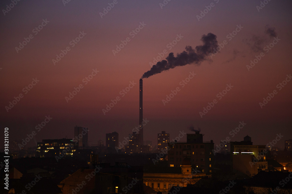 Zagreb, capital of Croatia, panoramic view of the city in night, power plant chimney over the city