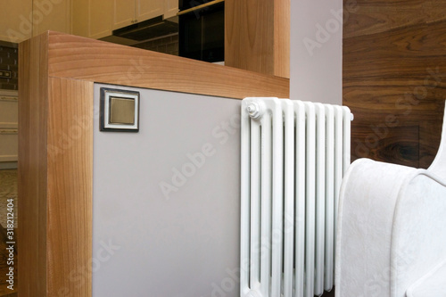 Wallpaper Mural White armchair on the balcony near the battery, with fashionable shelf trim Torontodigital.ca