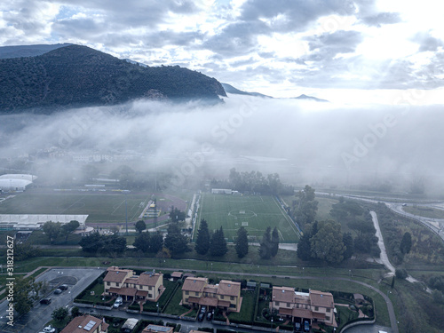 Clouds and fog over the town, Tuscany