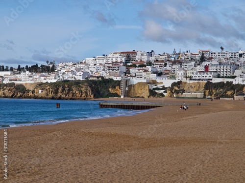 Beautiful beach with cityscape in Albufeira at the blue Atlantic ocean © Stimmungsbilder1