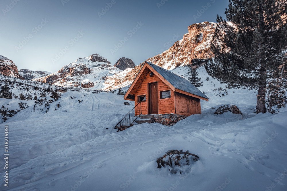 Small wooden chalet in front of Malyovitsa peak- one of the highest peaks in Rila mountain, Bulgaria
