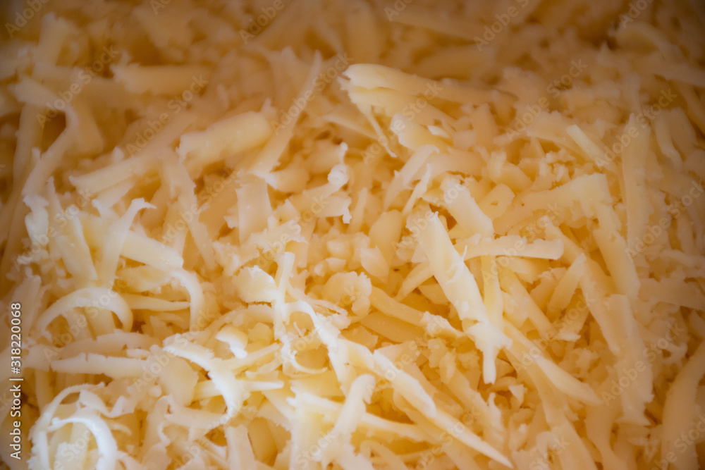 Grated appetizing cheese close-up  