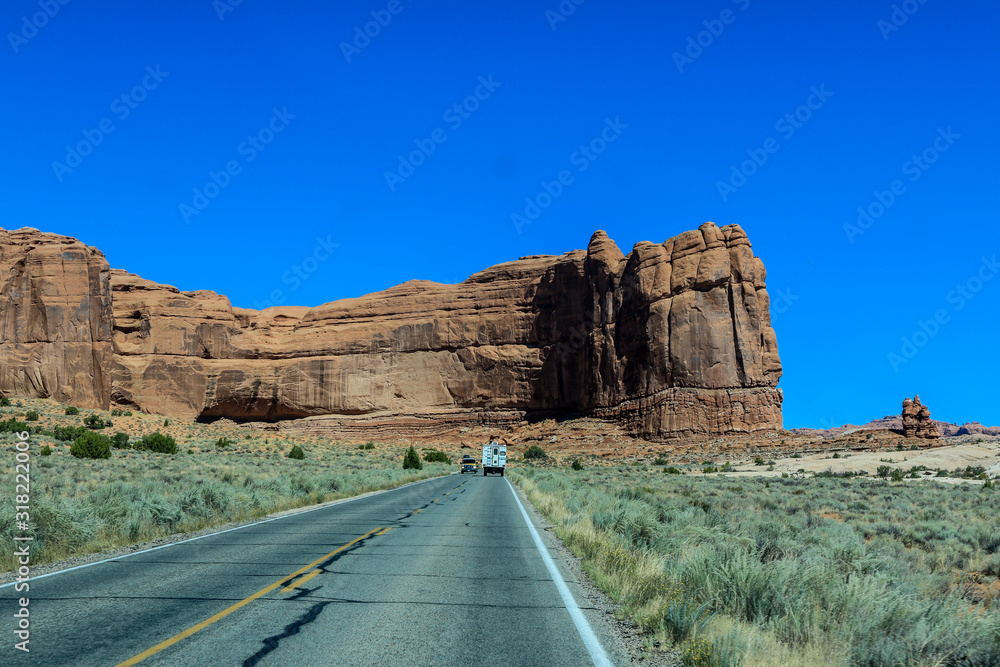 Car in the Road in Arches National Park, USA Car in the Road in Arches National Park, USA