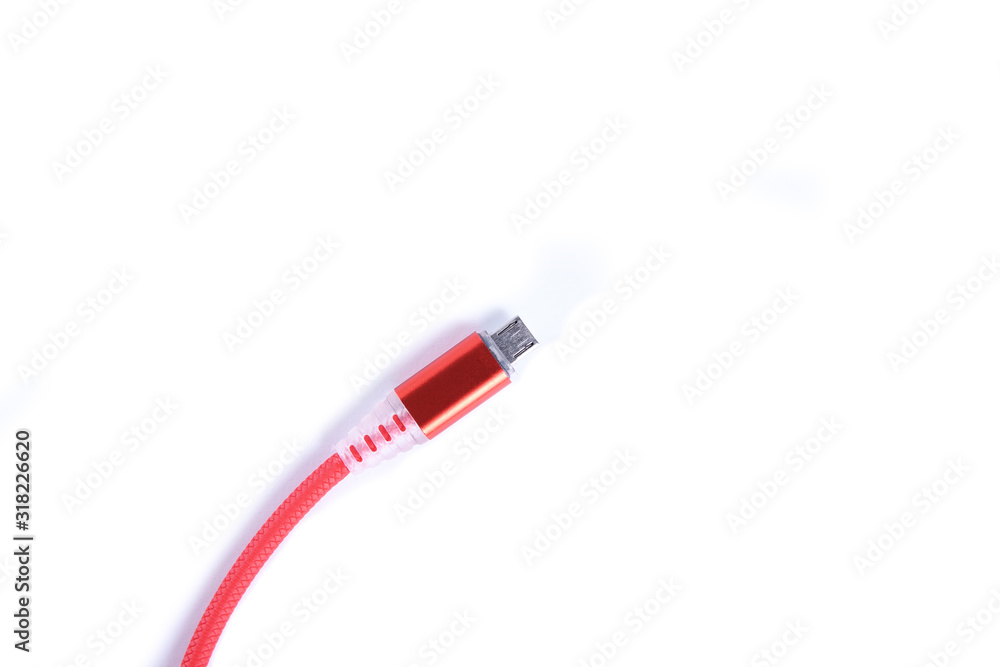 Red USB cable for smartphone charge isolated on white background. Red USB cable for smartphone charge isolated on white background.