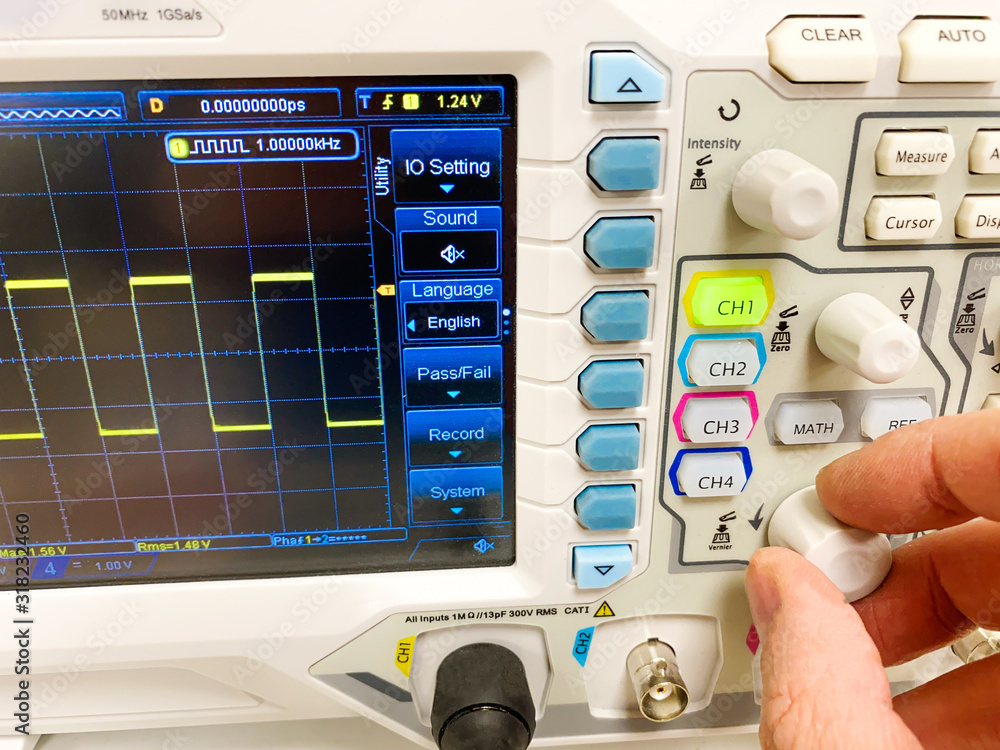 A Technician using electronic laboratory instrument A Technician using electronic laboratory instrument