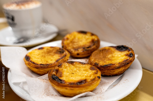 Canvas Print Plate of freshly baked egg tart or custard tart (pastel de nata), a famous dessert in Lisbon Portugal