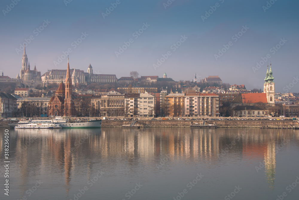 Panoramic scape of the old town Budapest. View on Fisherman's Bastion, Matthias Church, Reformed Church and Danube river on the foreground.  Hungary. Top tourist attraction in Europe. 
