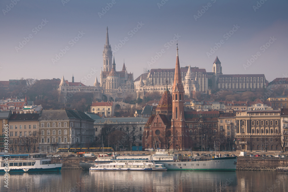 Obraz premium Panoramic scape of the old town Budapest. View on Fisherman's Bastion, Matthias Church, Reformed Church and Danube river on the foreground. Hungary. Top tourist attraction in Europe.