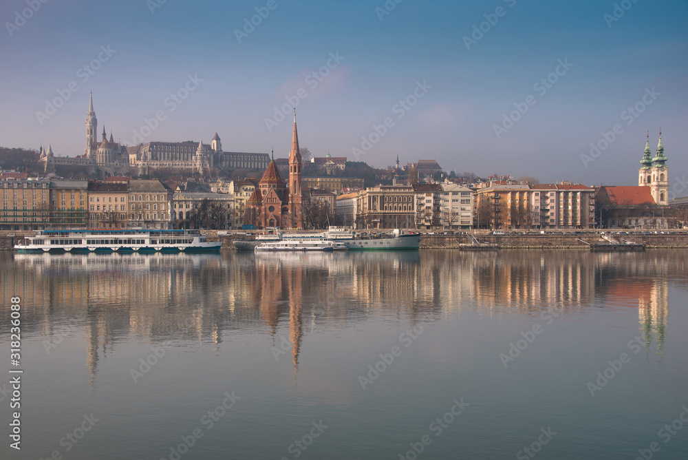 Panoramic scape of the old town Budapest. View on Fisherman's Bastion, Matthias Church, Reformed Church and Danube river on the foreground.  Hungary. Top tourist attraction in Europe. 