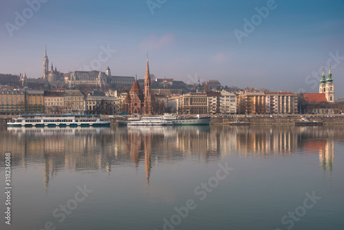 Panoramic scape of the old town Budapest. View on Fisherman's Bastion, Matthias Church, Reformed Church and Danube river on the foreground. Hungary. Top tourist attraction in Europe. 