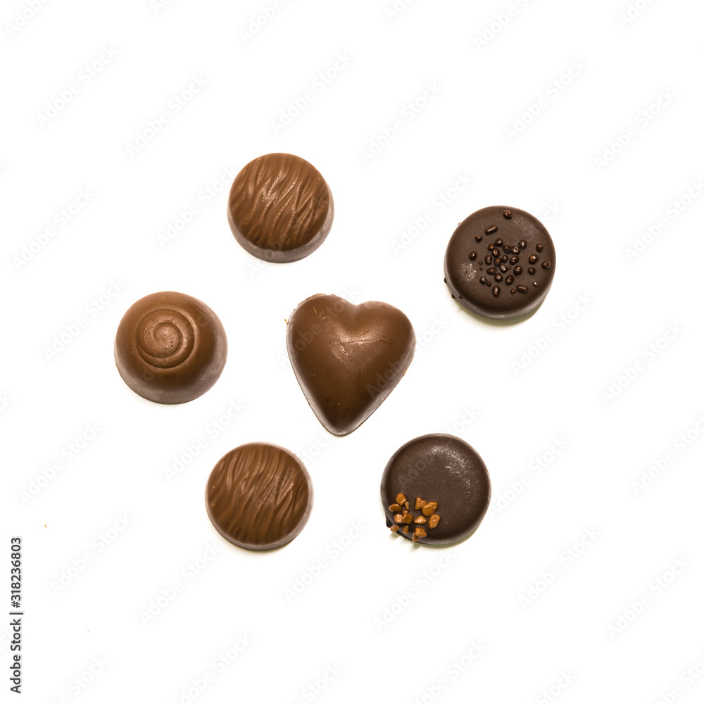 Studio shot wide selection of chocolate pralines isolated on white top view Studio shot wide selection of chocolate pralines isolated on white top view