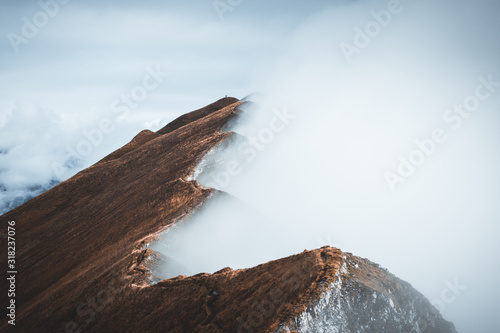 Moody view from the Augstmatthorn in the Bernese Oberland. Overlooking the scenery from the Augstmatthorn, with fog surrounding ridges in the  Emmental Alps