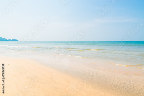 Beautiful beach view with fishing boat  yellow sand and blue ocean  Goa state in India