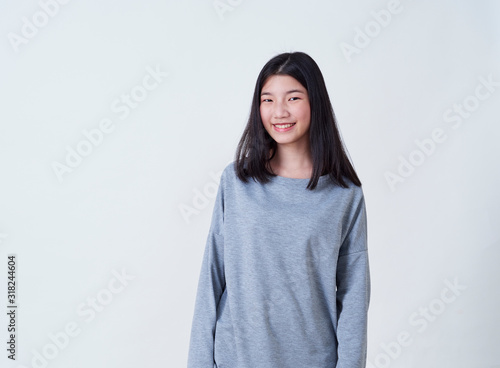 Smiling young woman over white background © jittima