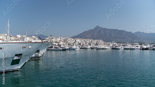 marbella marina scape on a sunny day with houses, boats and the sea, spain