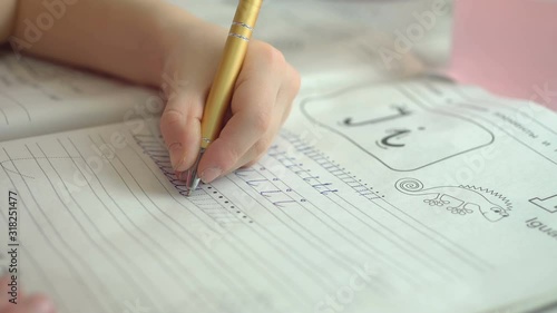 child writes prescriptions with his left hand. Lefty learns to write