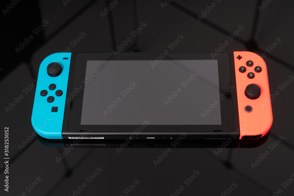 Nintendo Switch video game console developed by Nintendo, released on March  3, 2017 on a white background. Germany, Berlin - June 30, 2019: Nintendo  Switch Joy-con controller on a white background Stock Photo