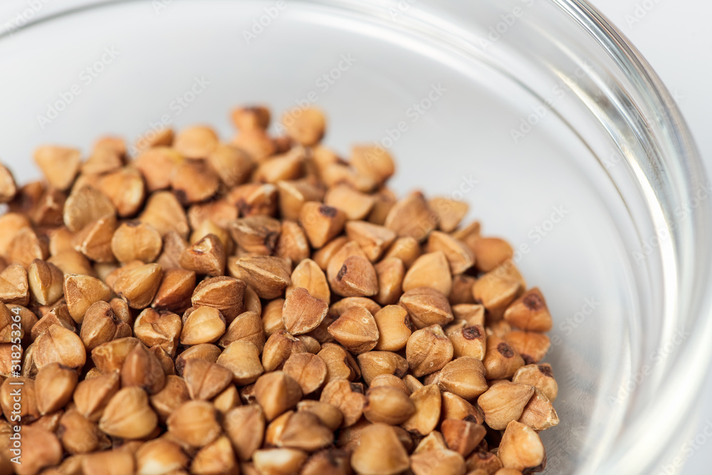Plate of buckwheat on white table Plate of buckwheat on white table