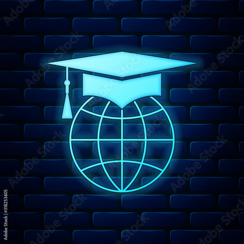Glowing neon Graduation cap on globe icon isolated on brick wall background. World education symbol. Online learning or e-learning concept. Vector Illustration