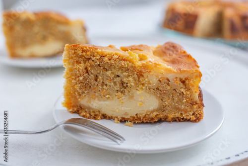 home made carrot cake cheesecake on a table