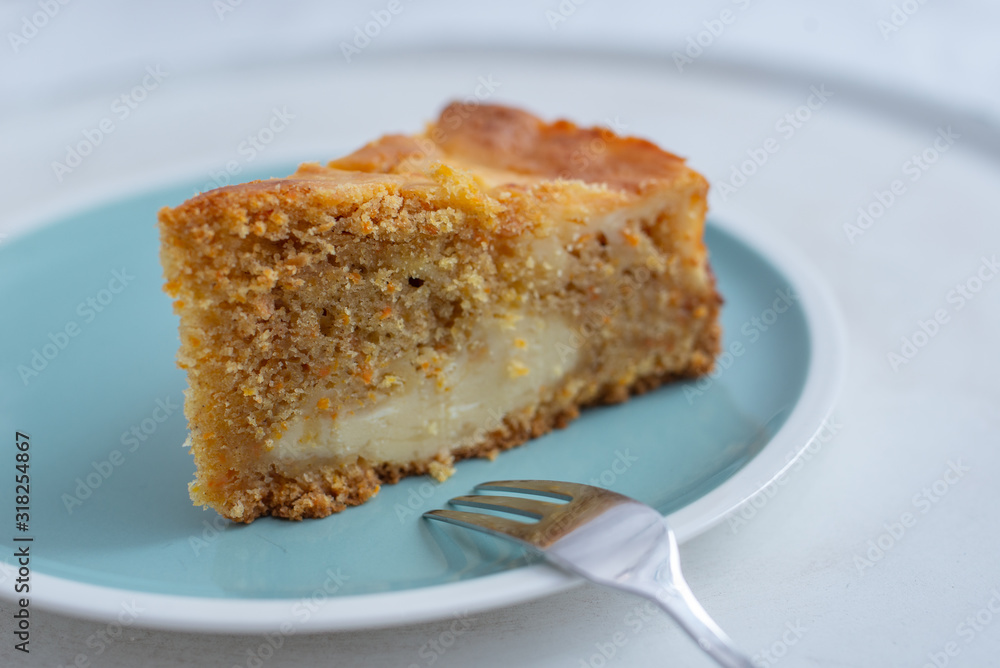 home made carrot cake cheesecake on a table home made carrot cake cheesecake on a table