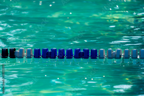 Swimming lane boundary in a pool, light reflections