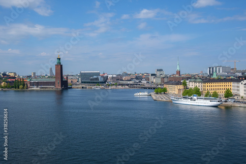 Embankment of the old city on a sunny day, town hall. Stockholm, Sweden. © Arkd