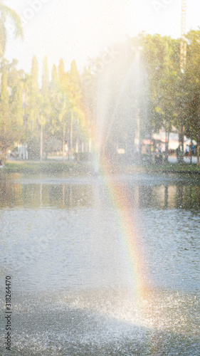 Rainbow that is colorful on natural water.