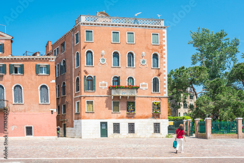 Venice. View of Venice Streets, canals, bridges, gondolas. Biennale. Colorful Old Authentic Buildings in Venice: doors, windows. Architecture of Ancient Italian city. Travel Tourism Concept. 
