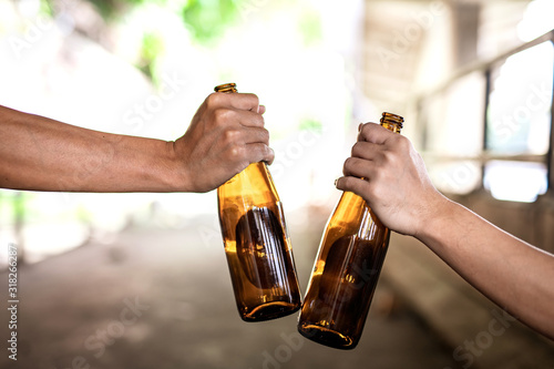 Portrait The second hand is holding a liquor bottle. photo