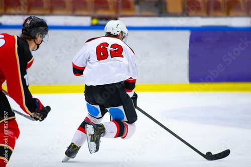 Ice hockey player with the puck