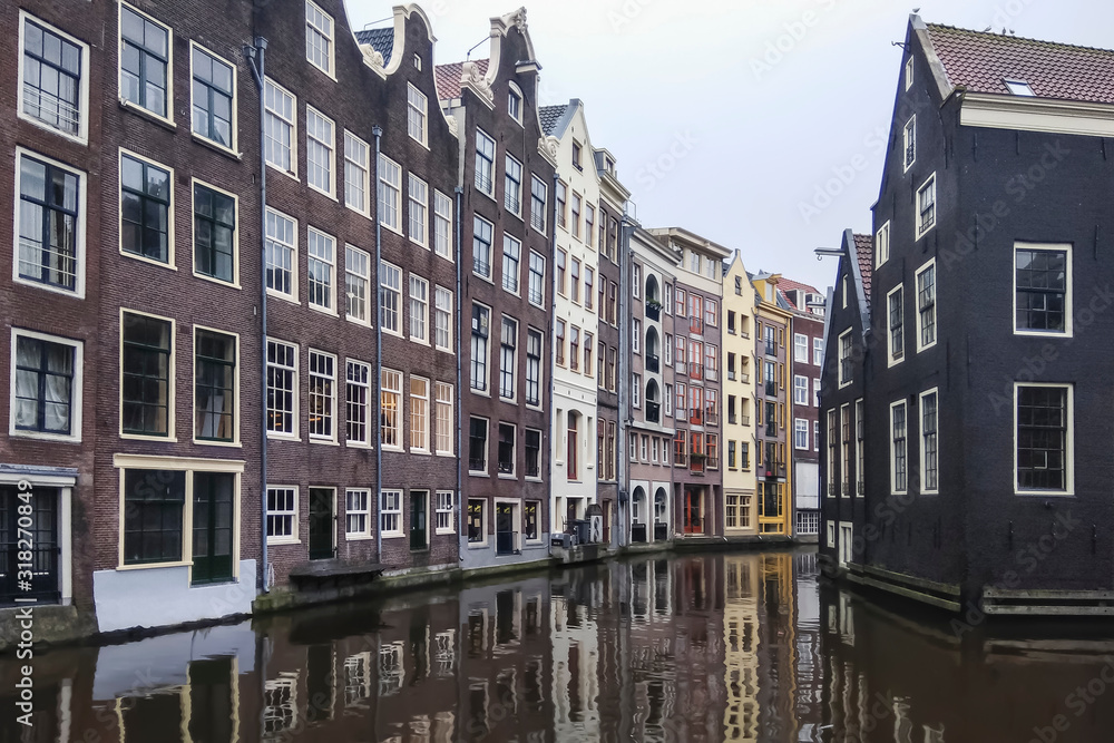 Old houses of Amsterdam, standing on the Keizersgracht canal, a picturesque old street, Netherlands, Holland