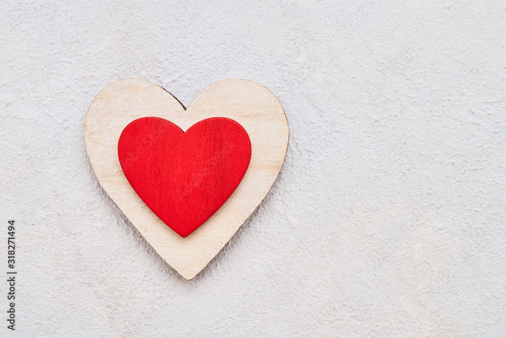 Valentines Day background with wooden hearts on a concrete background, top view. Valentines Day concept Valentines Day background with wooden hearts on a concrete background, top view. Valentines Day concept